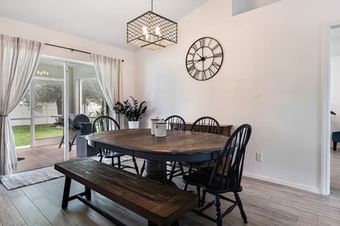 Dining room, big enough for 6 people plus high chair. There are two more seats at the kitchen island.