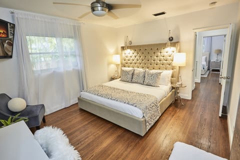Sink into serenity in this king suite—featuring a plush bed, smart TV, private workstation, and a walk-in closet that feels like its own room. Designed for rest, space, and indulgence.