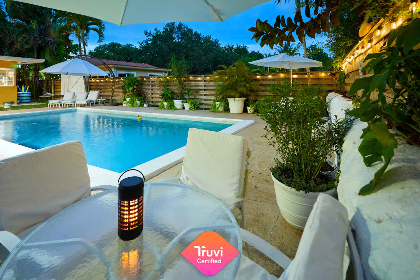 Your evening oasis—string lights, warm water, and Miami nights that feel like magic.