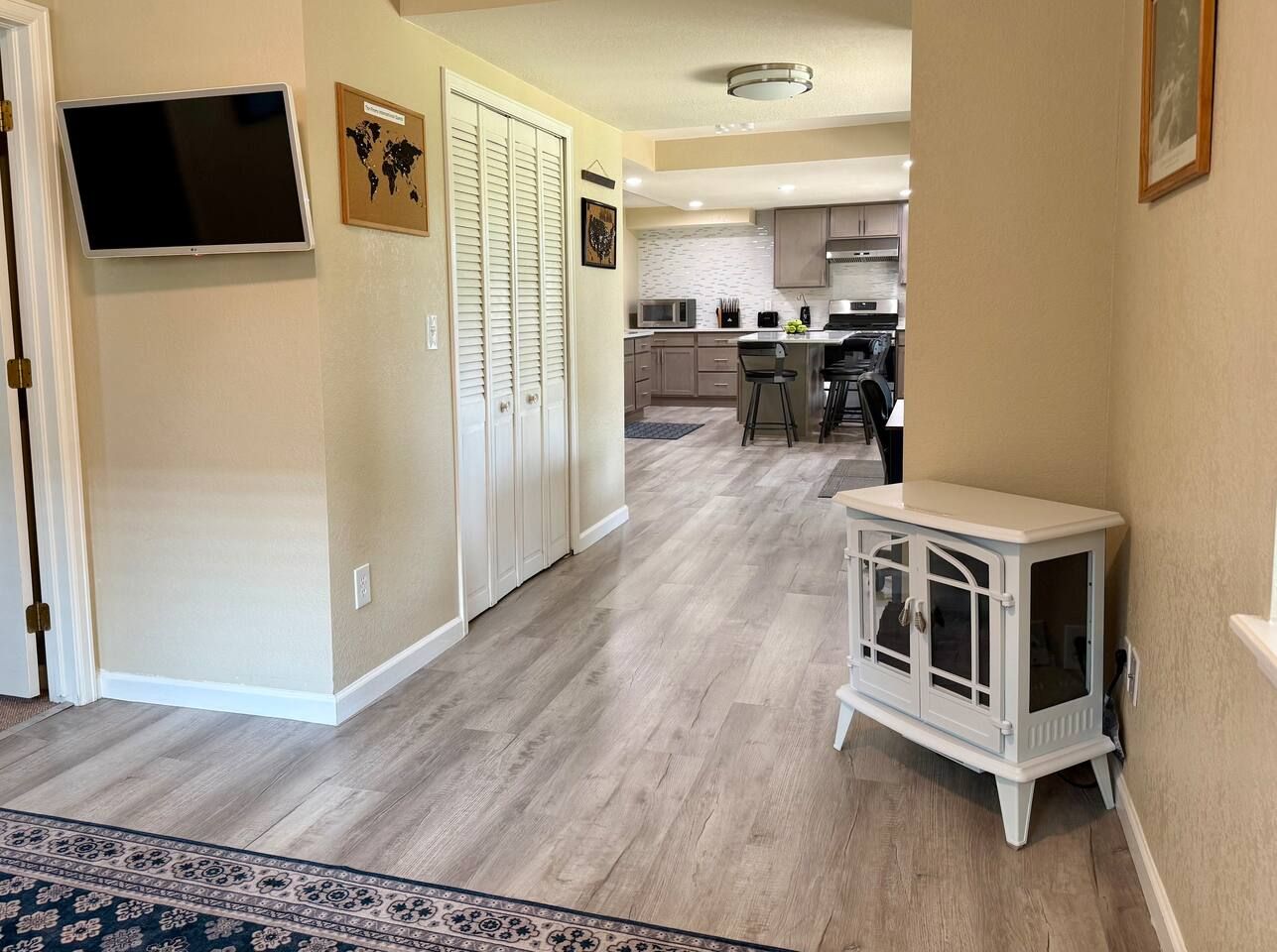 Relax in the cozy sitting area with the electric fireplace and wall mounted TV