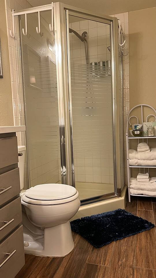 3/4 bathroom is equipped with shampoo, conditioner, body wash and a hairdryer. 