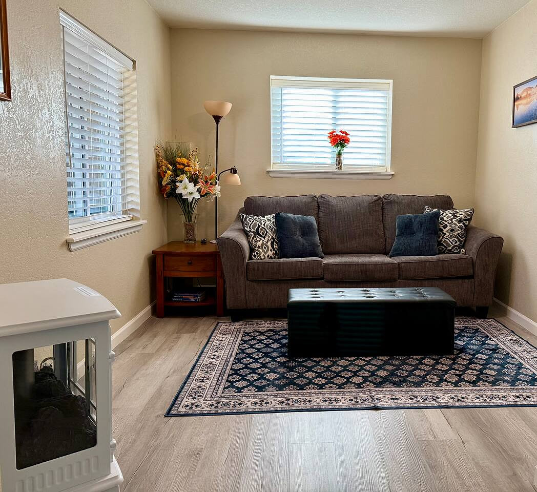 Relax in the cozy sitting area with the electric fireplace and wall mounted TV