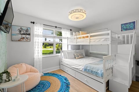 Bedroom offers 2 new twin beds and 1 new full bed. Also includes new smart TV and ceiling fan.