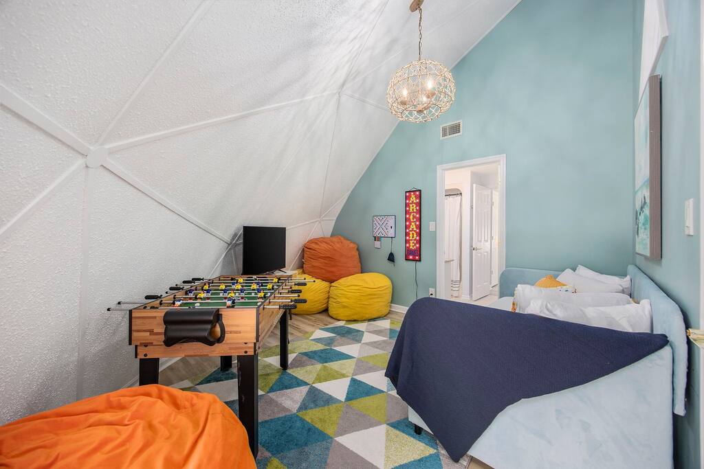 Bedroom 5 doubles as a Game room with foosball, air hockey, mini-pool, and min-ping pong. Bean bag chairs are always popular with kids and adults alike