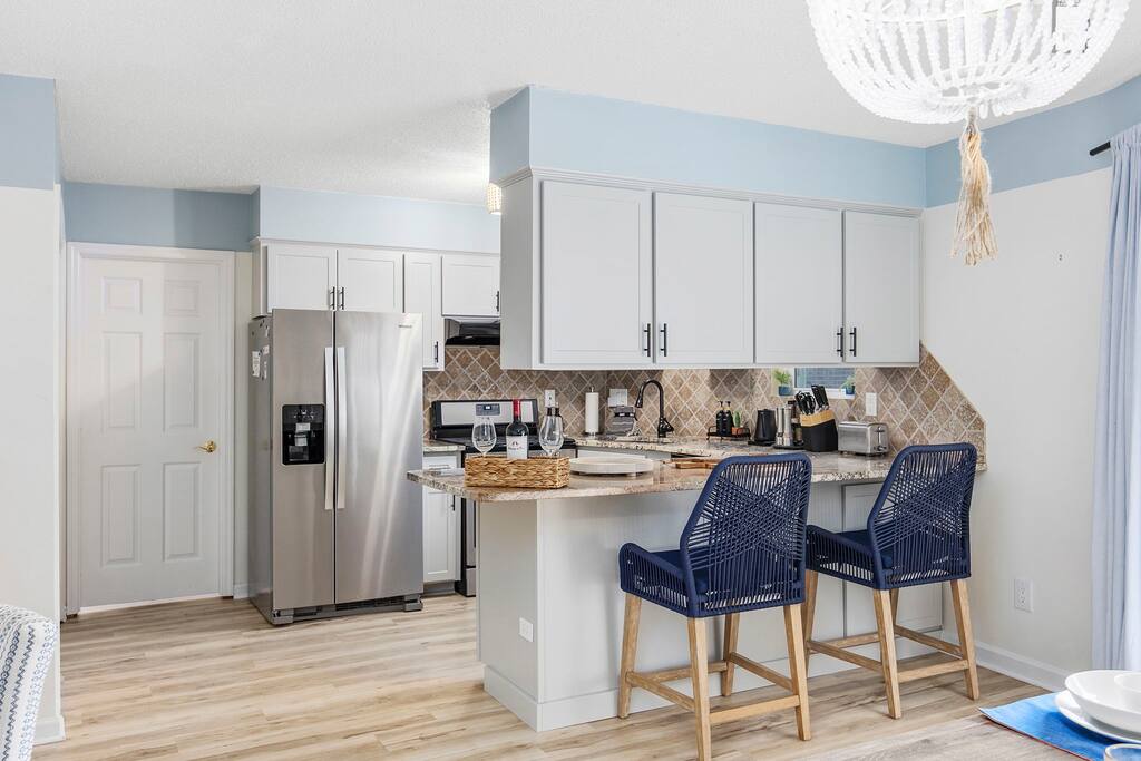 Breakfast counter in the kitchen ; Whirlpool Gold Double door fridge/freezer with ice and water dispenser