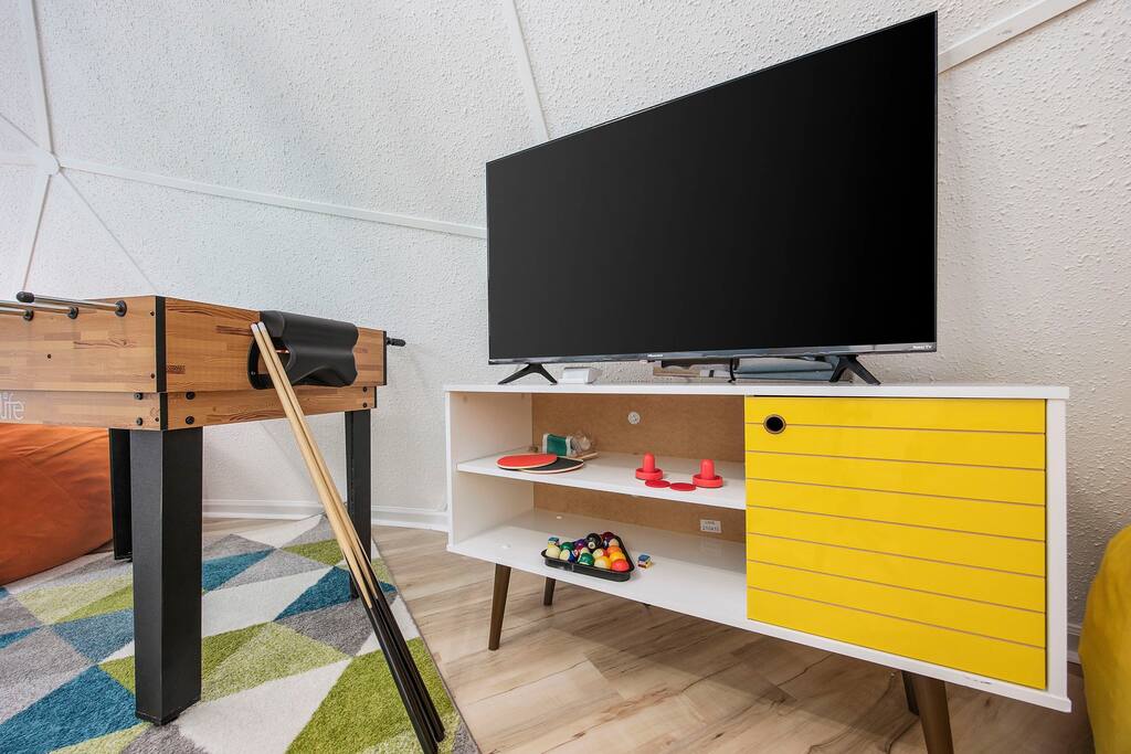 Bedroom 5 doubles as a game room with foosball, air hockey, mini-pool, mini ping pong.