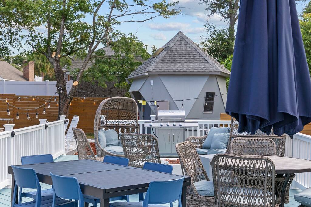 Gas Fired Barbeque Grill on deck with barbeque utensils and a propane cylinder.
Out door dining table has hidden leaf that can expand to seat a larger group on one table. There are two such tables on the deck.