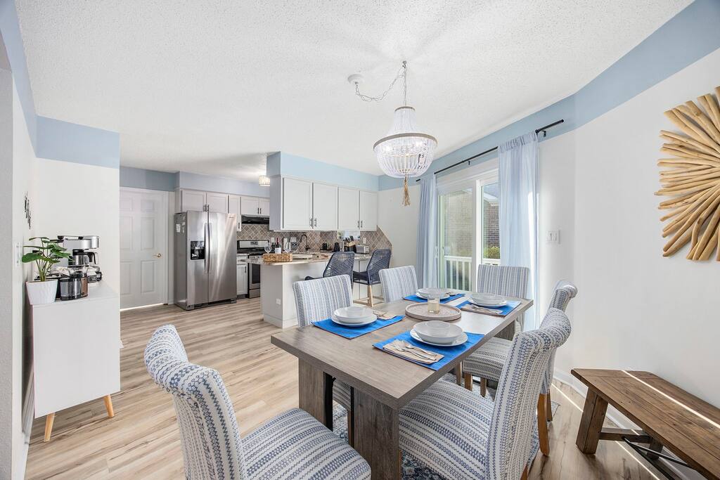 Flexible dining space with a provided bench to seat more on one side of the table.