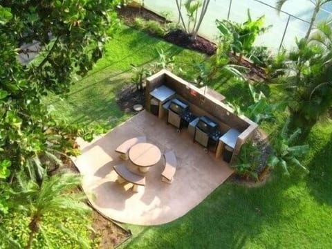 Well maintained gas BBQ grill area right outside the door.