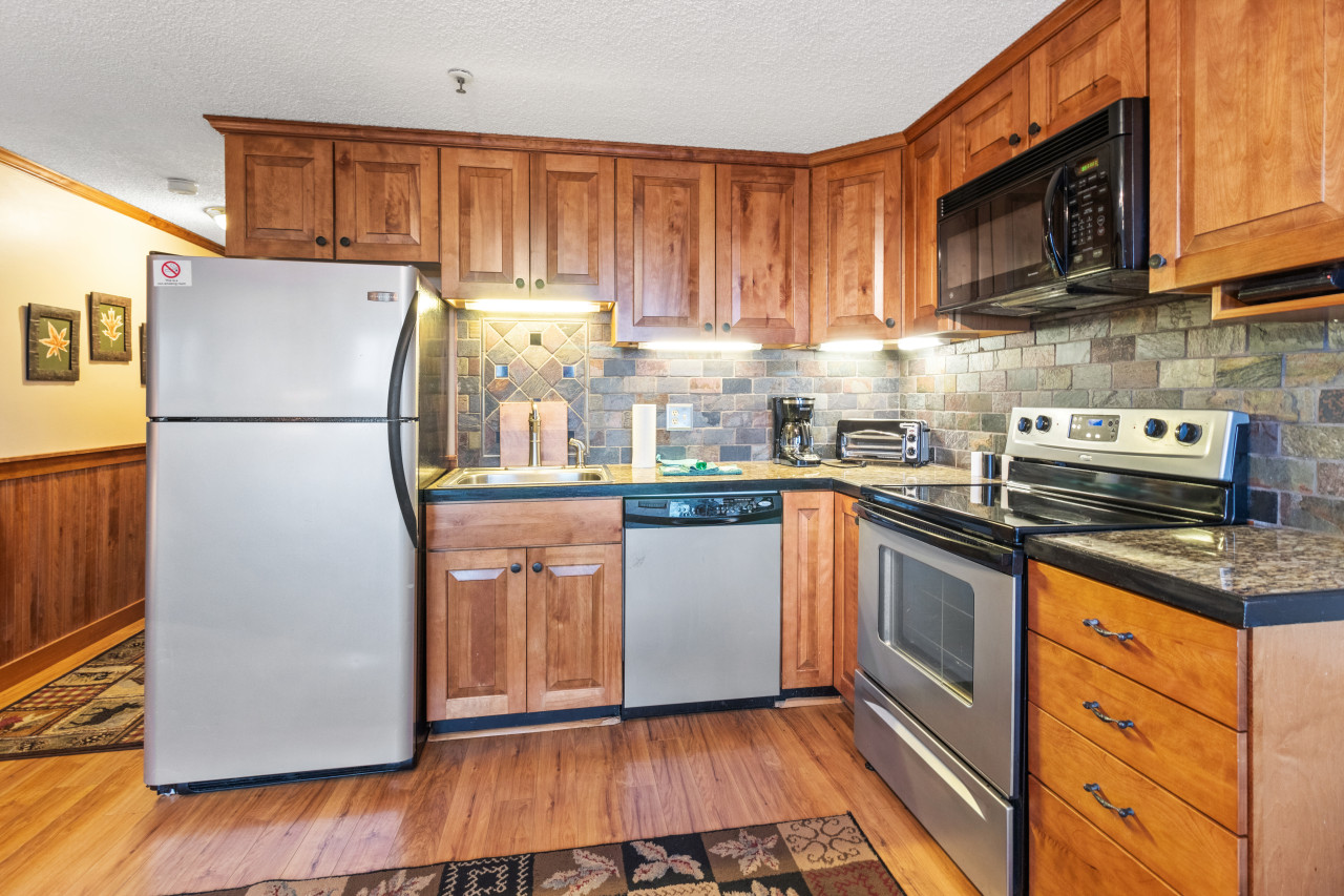 Remodeled kitchen is fully-equipped with pots, pans & utensils.