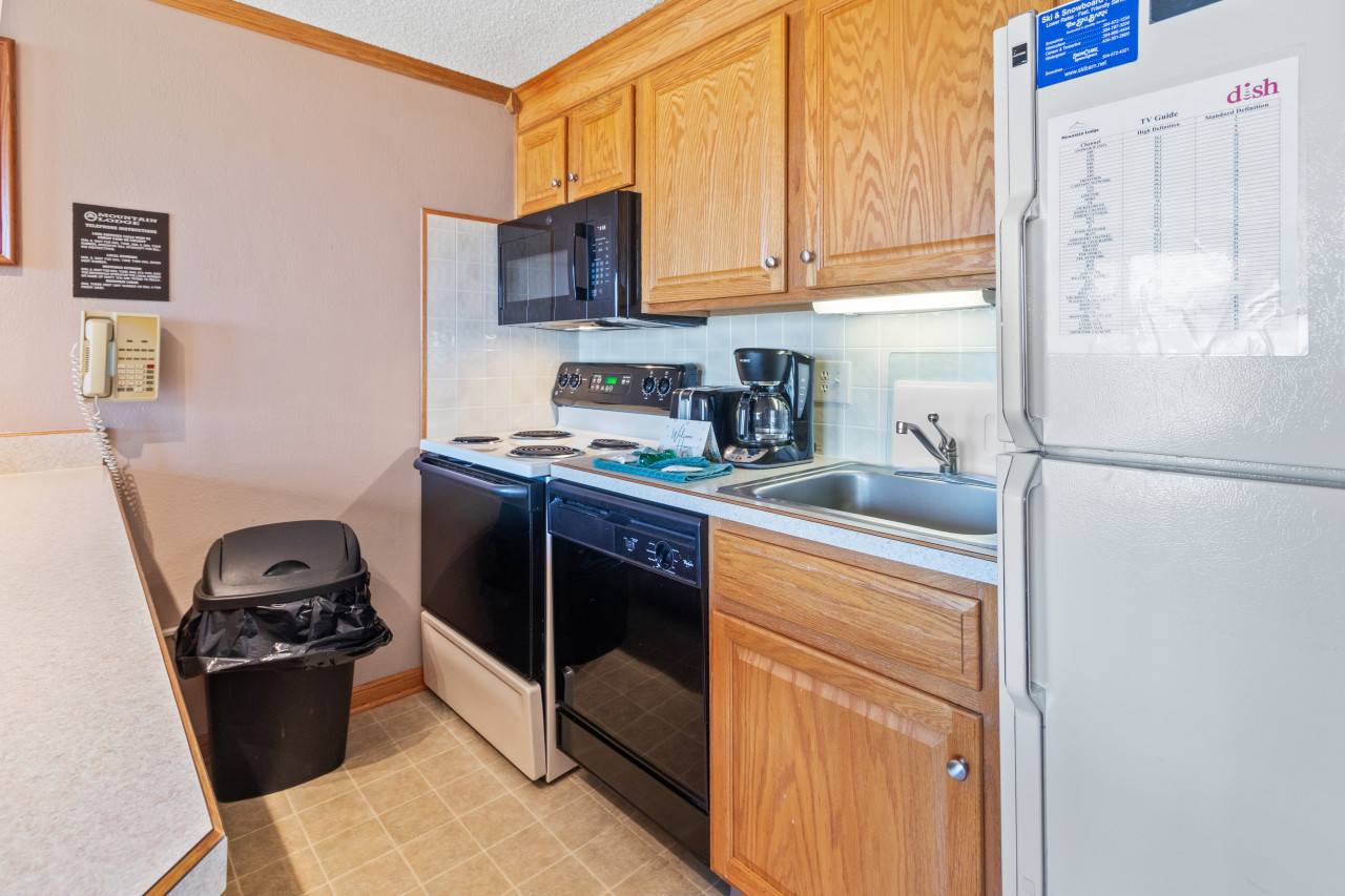 Remodeled kitchen is fully-equipped with pots, pans & utensils