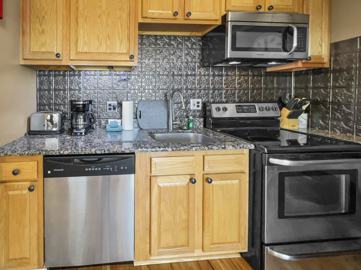 Remodeled kitchen is fully-equipped with pots, pans & utensils.