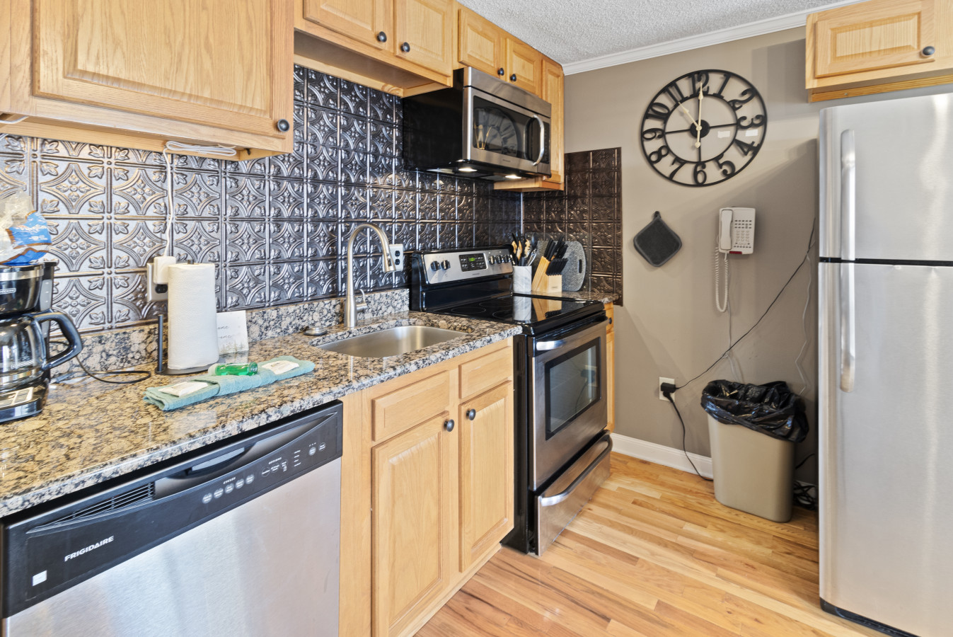 Remodeled kitchen is fully-equipped with pots, pans & utensils