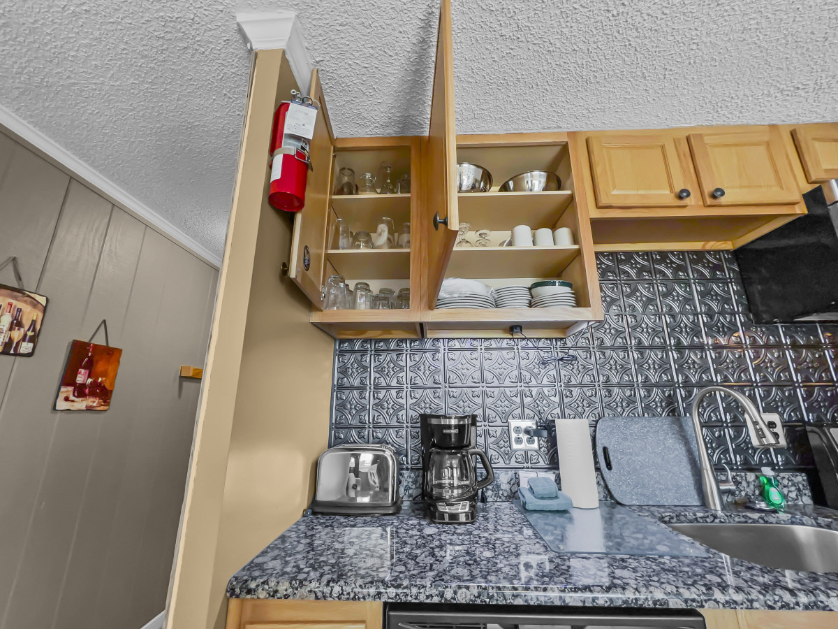 Remodeled kitchen is fully-equipped with pots, pans & utensils