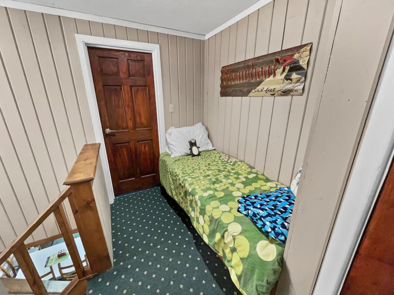 Kid-friendly bunk at the top of the stairsA