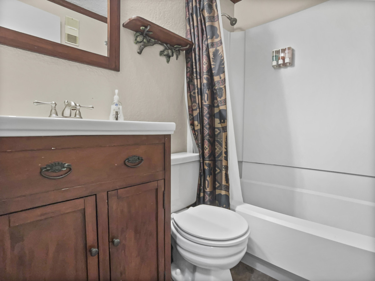 Clean bathroom with tub and shower