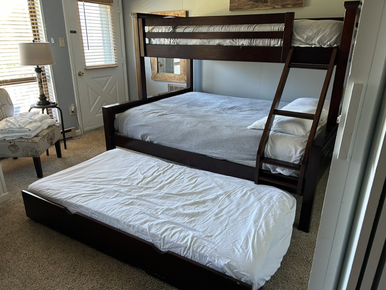 Triangle Bunk has Full on the bottom, twin on top and twin trundle below.