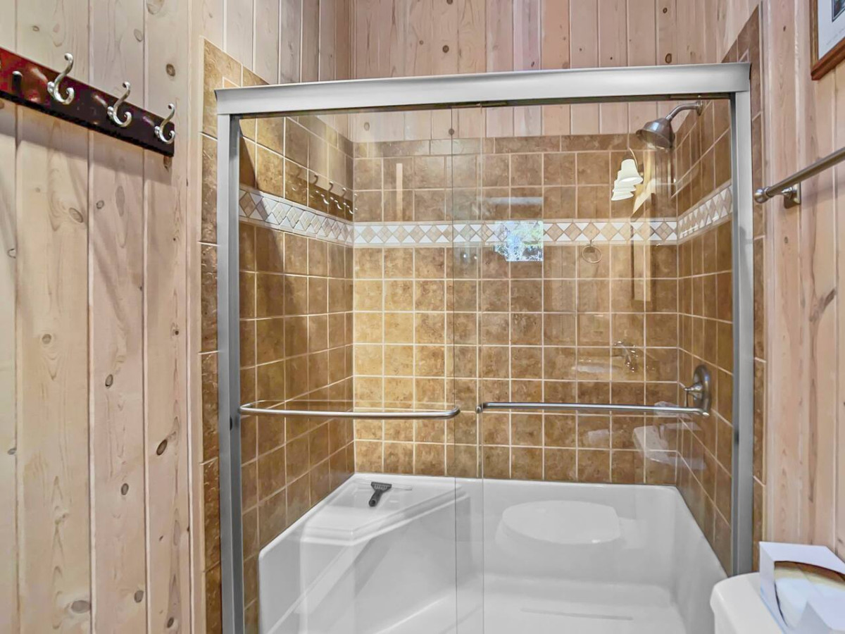 Tiled shower and upstairs bathroom