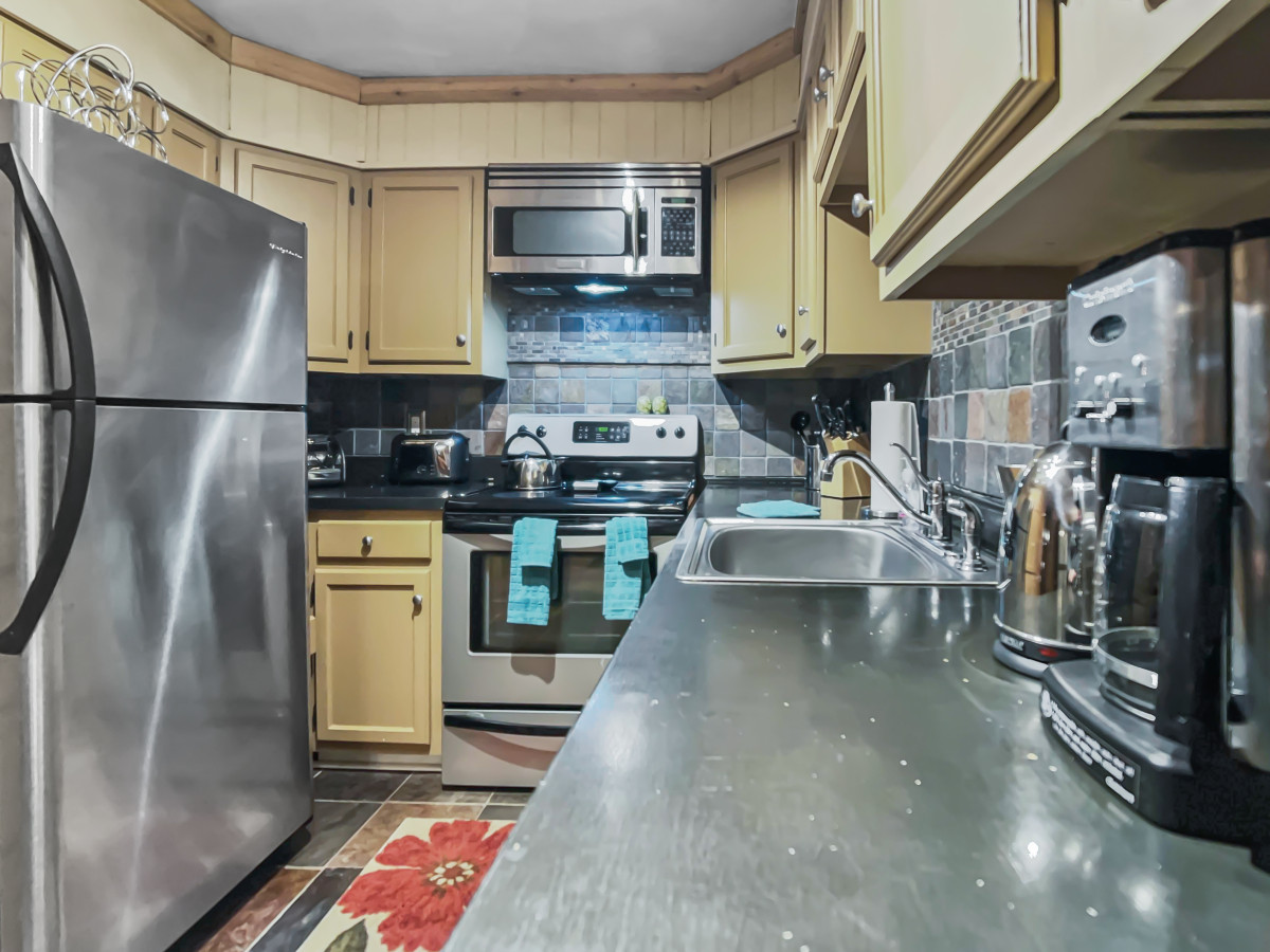 Full kitchen with stainless steel appliances