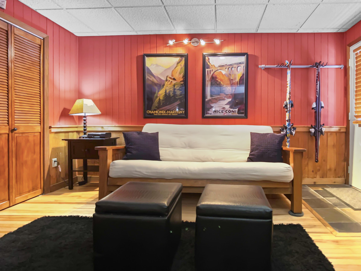 Ski rack next to the futon bed