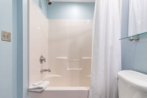 Clean bathroom with tub and shower