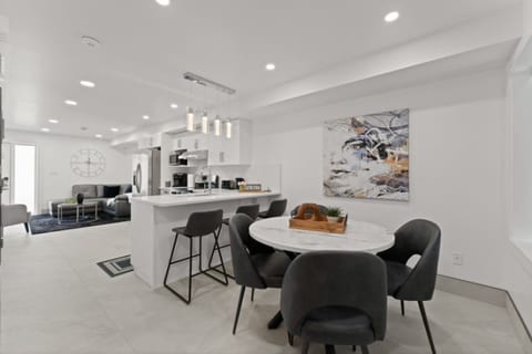 Sleek dining table paired with sculptural chairs