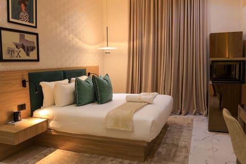 Escape to comfort in our inviting bedroom retreat, a cozy space for unwinding and rejuvenation.