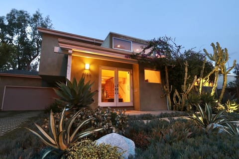 Front of house. Golf course is behind photographer. Driveway and plenty of free street parking.