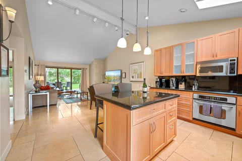 Open floor plan for kitchen and living room. New kitchen supplies, fully stocked! New 75 inch smart TV. Golf views out rear patio