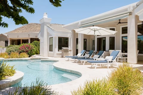 Pool loungers overlooking the lake