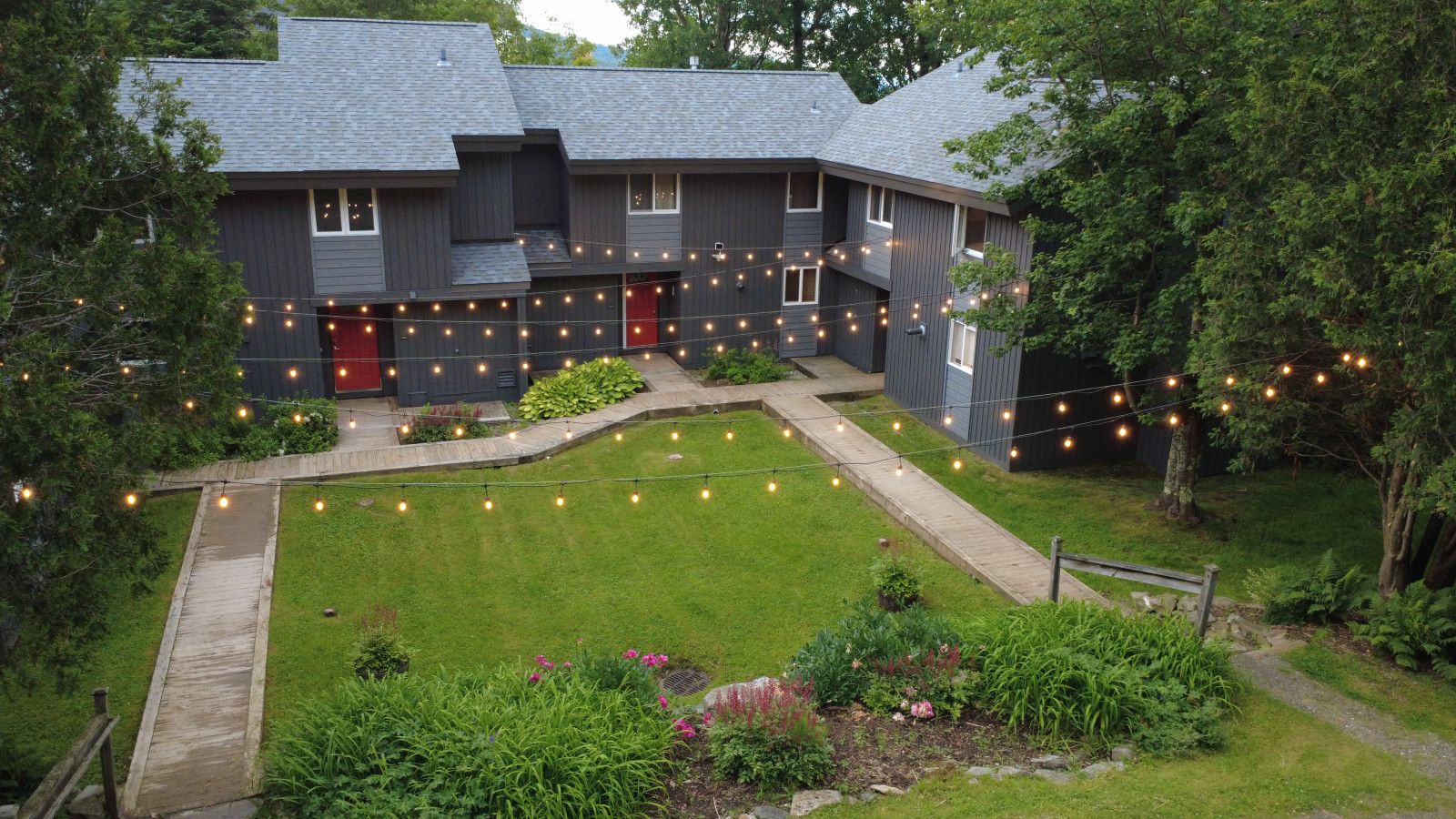 End unit condo with nice bistro lights to light up the courtyard and parking area End unit condo with nice bistro lights to light up the courtyard and parking area - Jay Peak, VT - Newly Renovated Ski-In/Out by Waterpark - Jay
