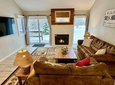 Cozy Great Room with Propane Fireplace — The perfect place to relax after a full day skiing Jay Peak’s legendary powder.