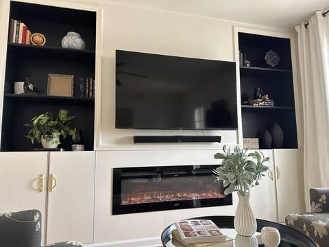 Entertainment center with heat generating digital fireplace