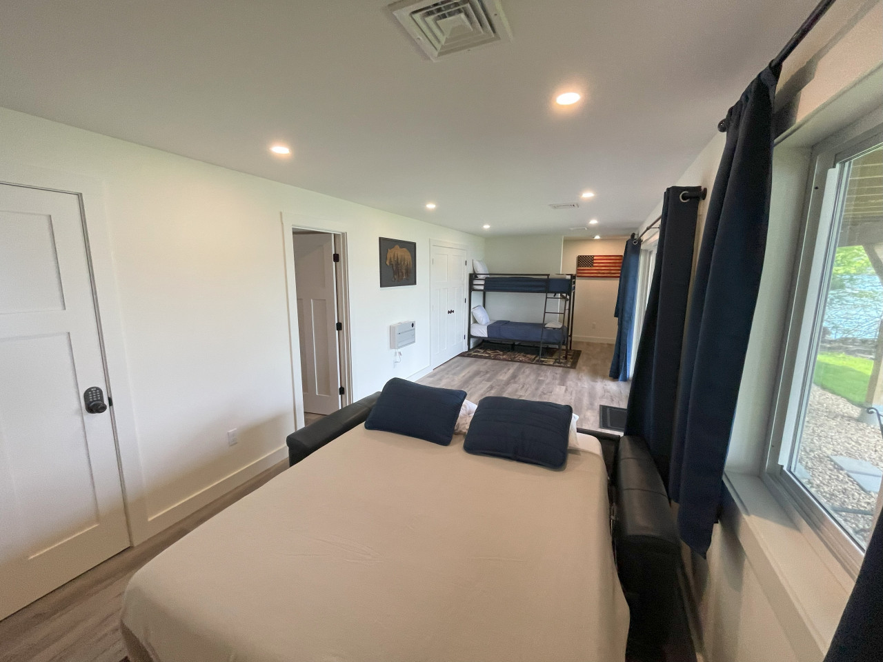 High quality sofa bed with thick mattress. Overlooks the water & you have your own private slider for walk-out entry to the water High quality sofa bed with thick mattress. Overlooks the water & you have your own private slider for walk-out entry to the water - Merrymeeting Lake - New Luxury Waterfront Home w/ Private Dock & A/C - New Durham