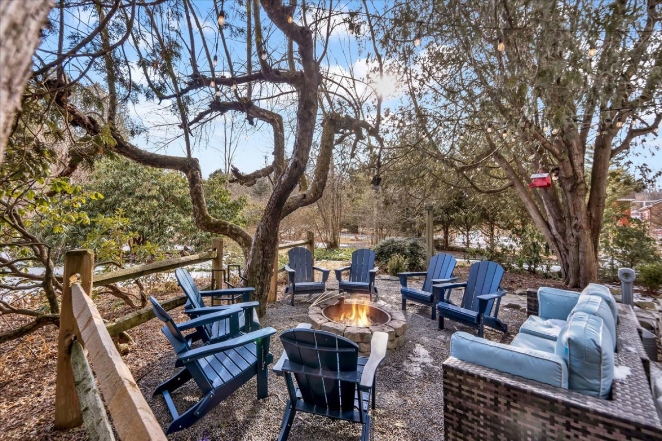 Cozy up around the firepit with comfortable outdoor seating—perfect for making memories under the stars!