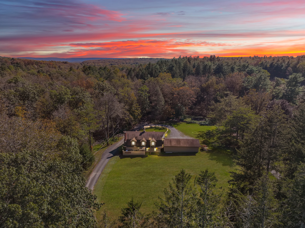 Twilight aerial view of The Stable House