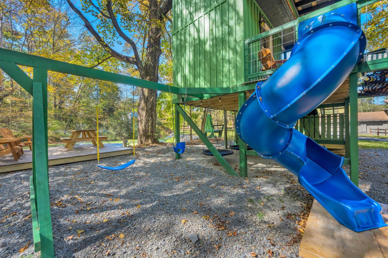 Spiral tube slide and swing, ready for the kids to enjoy!