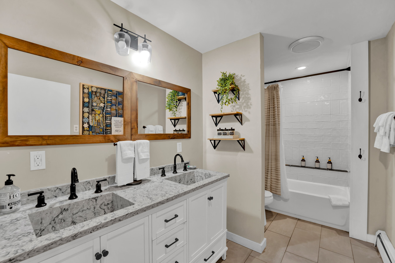 Full Bathroom 2, featuring a relaxing tub-shower combo — perfect for a soothing soak or a quick shower to start your day.