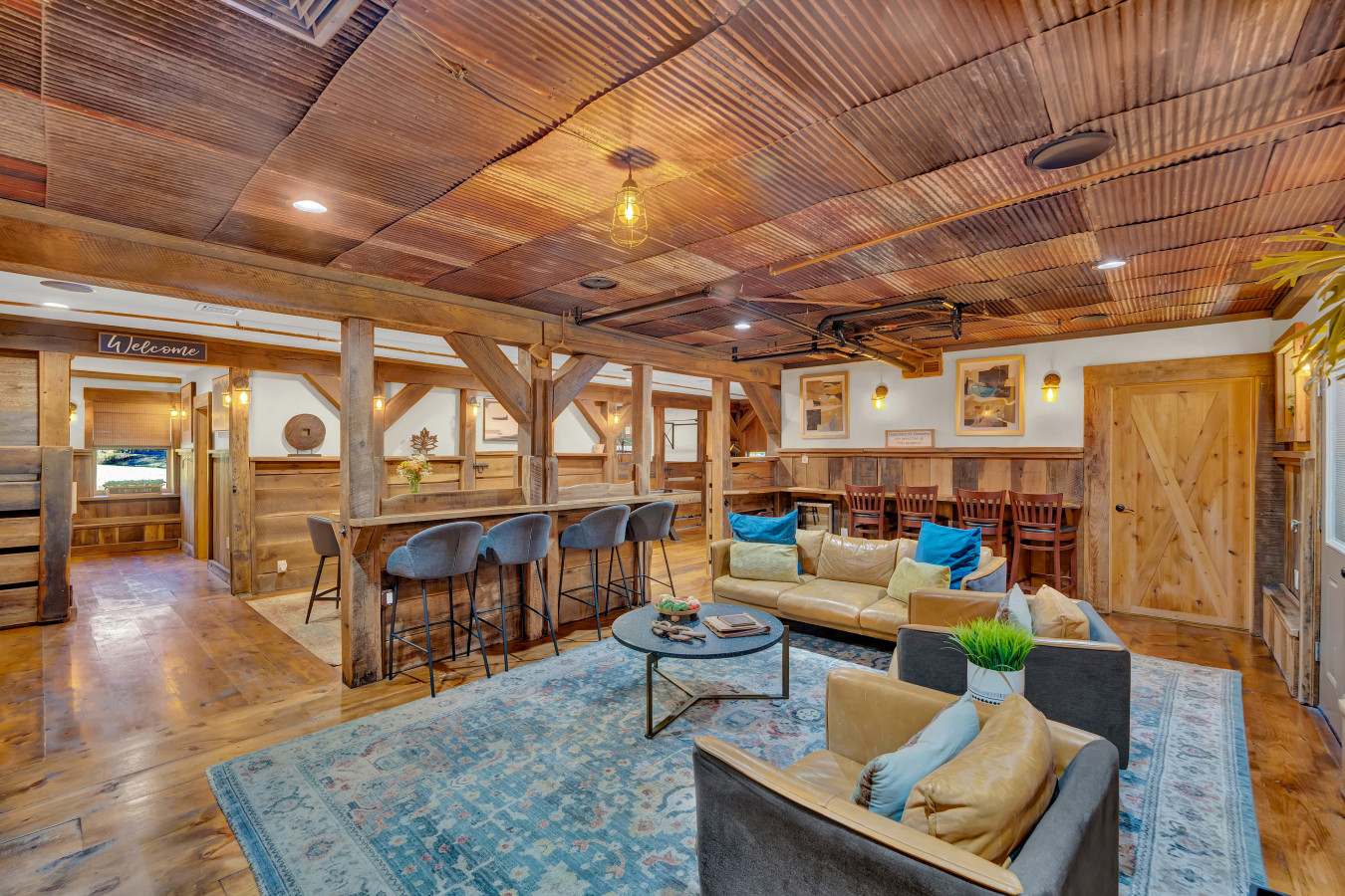 Step into the spacious, open lounge area at The Stable House.