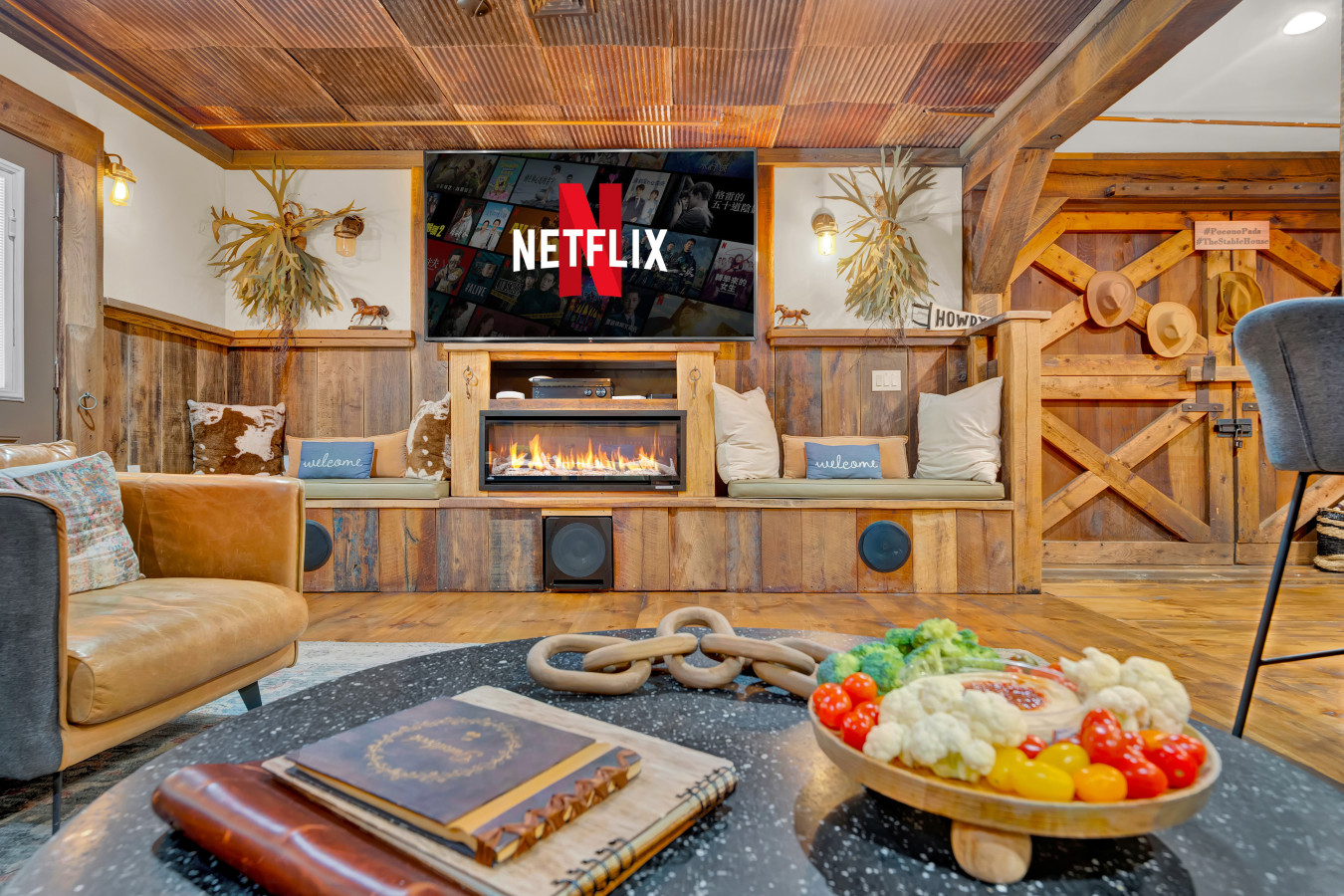 Relax in the lounging area at The Stable House — a perfect spot to unwind with friends or family, featuring cozy seating and a laid-back vibe.