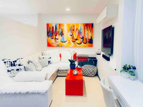Living room with hydronic- radiant heat polished cement floor
