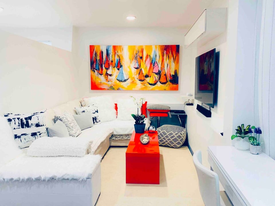 Living room with hydronic- radiant heat polished cement floor