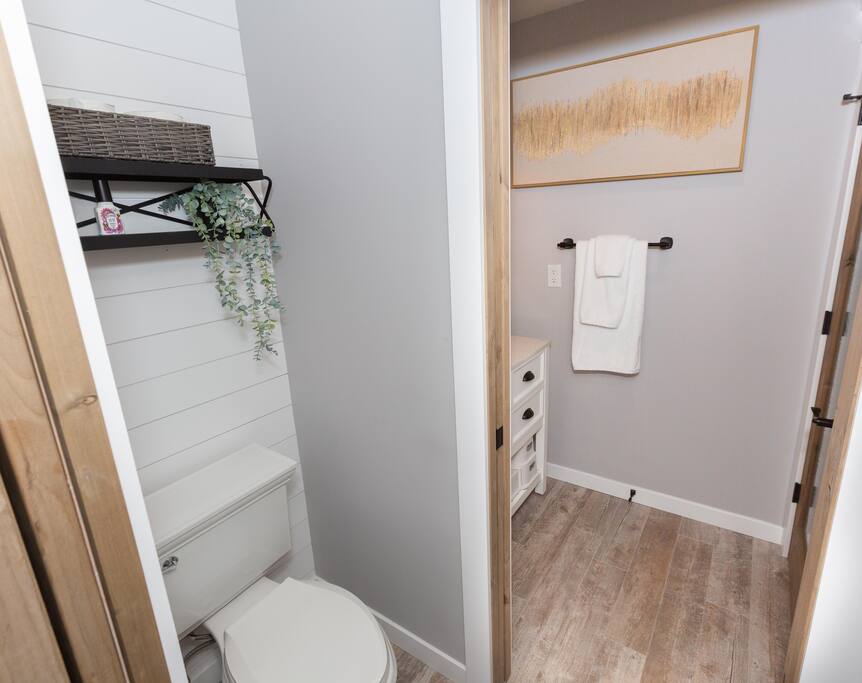 Toilet room that is accessible to the living room area and primary bedroom.  - Private Beach | Lakeside Luxe | Hike Kayak Paddle - Tahoe Vista