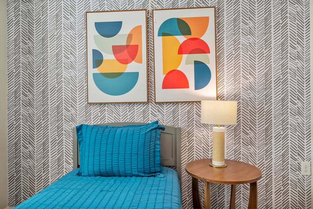 Indulge in style and comfort in this first guest bedroom, a perfect retreat for kids, tweens, or teens to enjoy a stylish slumber.





