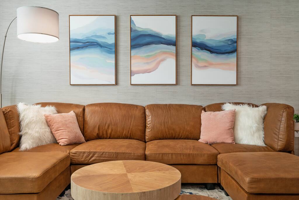 Settle into plush comfort on this inviting sofa, perfect for enjoying your favorite book in absolute coziness.