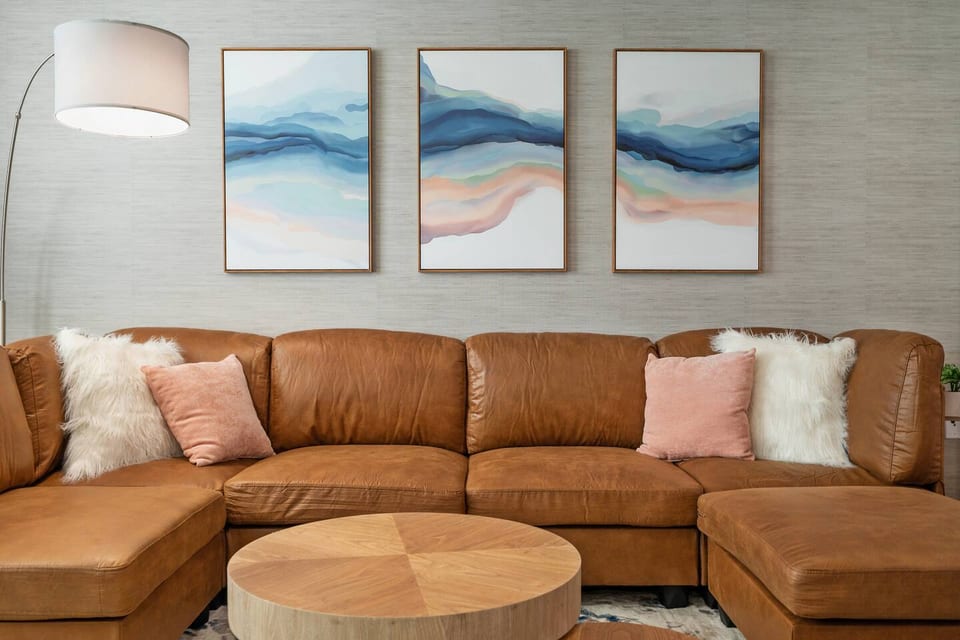 Settle into plush comfort on this inviting sofa, perfect for enjoying your favorite book in absolute coziness.