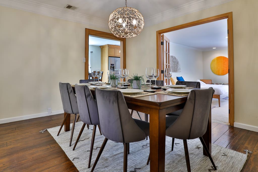 Generous dining area with breathtaking outdoor vistas, perfect for hosting exceptional meals and family or friend gatherings.