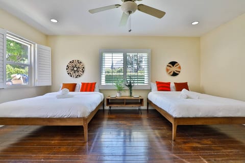Generous and inviting room featuring two single beds for your comfort.
