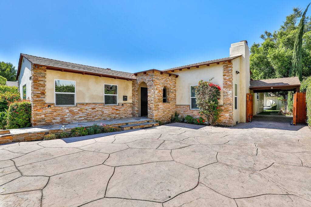 Entrance featuring a convenient garage for your vehicle's parking needs.