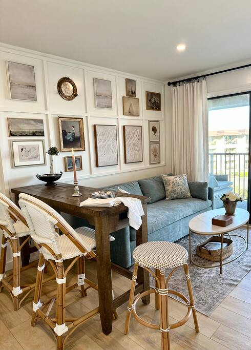 Beautiful Living Room with vintage-style Island and Serena & Lily Seating.  Stunning Ocean Views from Dining Area, Living Room & Balcony!